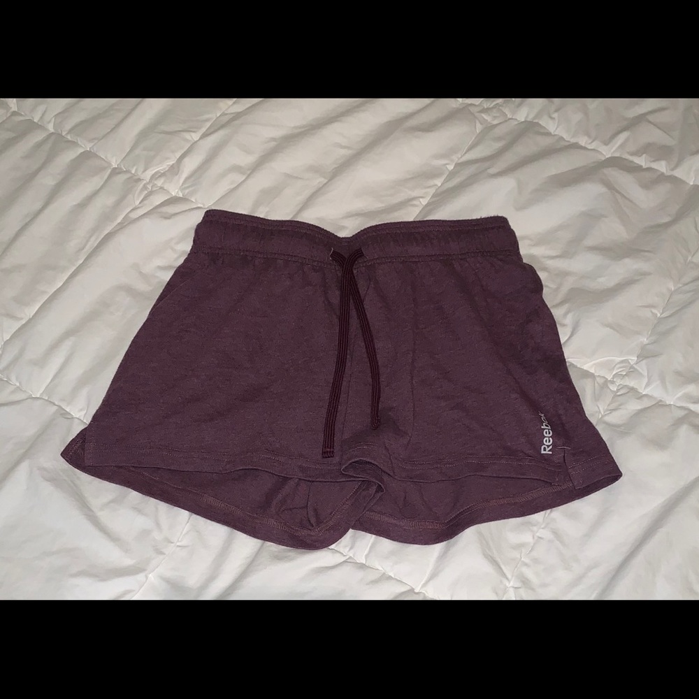 dark purple reebok cloth running shorts